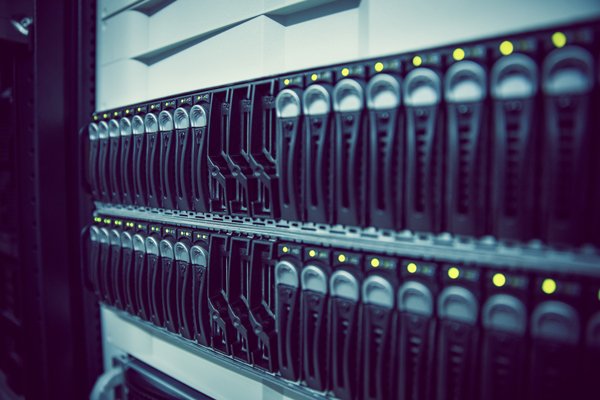 Close-up of server storage bays with green status lights